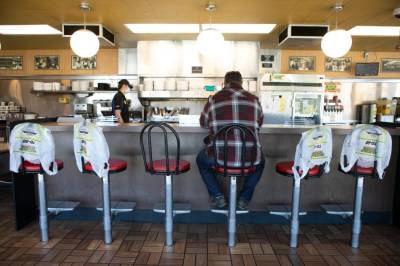 As States Allow Businesses to Reopen, Who Is Liable When People Get Sick?