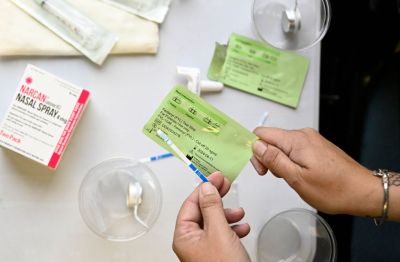 A Jefferson County, Colorado public health official holds a fentanyl test strip. (Photo by RJ Sangos...