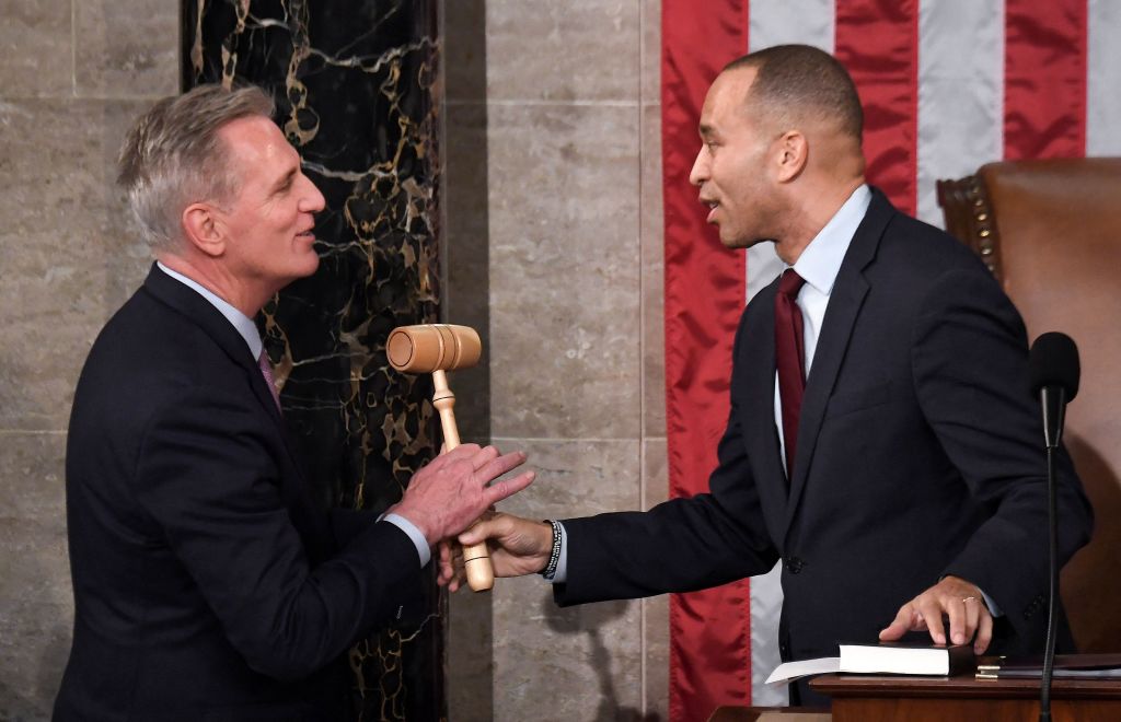 House Minority Leader Hakeem Jeffries hands the gavel to newly elected Speaker of the House of Representatives Kevin McCarthy early Saturday. (Photo by OLIVIER DOULIERY/AFP via Getty Images)