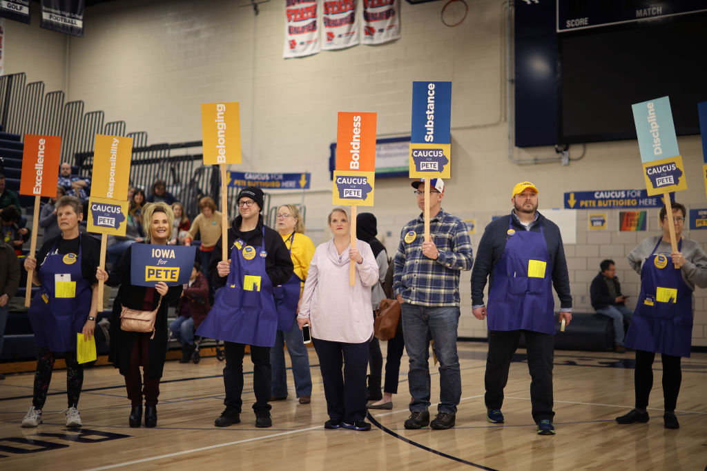Supporters of Democratic presidential candidate Pete Buttigieg prepare to caucus for him in a school gymnasium on February 3, 2020, in Des Moines, Iowa. (Photo by Chip Somodevilla/Getty Images)