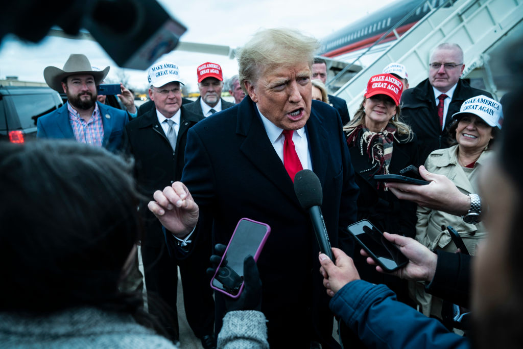 Former President Donald Trump speaks to reporters at Quad City International Airport, March 13, 2023, in Moline, Illinois. (Photo by Jabin Botsford/Washington Post/Getty Images)