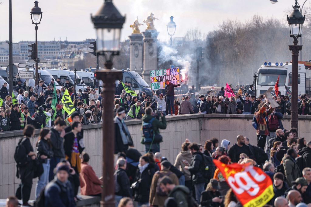 Protesters gather near Place de la Concorde in Paris on March 16. (Photo by Thomas SAMSON / AFP) (Photo by THOMAS SAMSON/AFP via Getty Images)