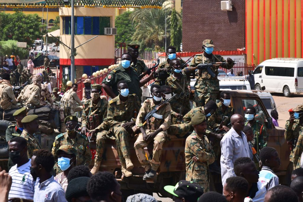 Sudanese security forces keep watch as they protect a military hospital and government offices during protests against a military coup overthrowing the transition to civilian rule on October 25, 2021 in the capital's twin city of Omdurman. (Photo by -/AFP via Getty Images)