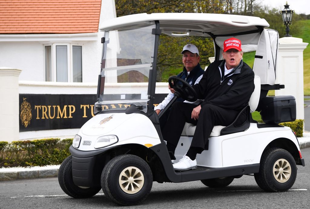 Former President Donald Trump drives a golf cart at the Trump Turnberry Golf Courses in Scotland on May 2, 2023. (Photo by Andy Buchanan/AFP/Getty Images)