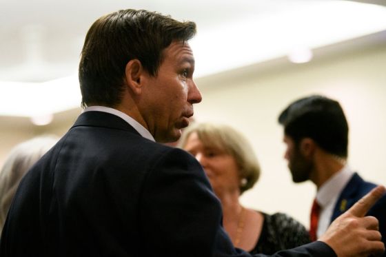 Florida Gov. Ron DeSantis speaks with attendees of an Iowa GOP reception. (Photo by Stephen Maturen/Getty Images)