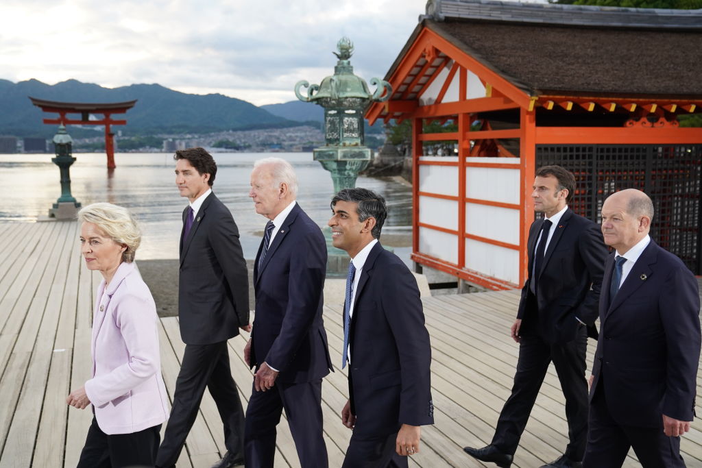 European Commission President Ursula von der Leyen, Canadian Prime Minister Justin Trudeau, US President Joe Biden, UK Prime Minister Rishi Sunak, French President Emmanuel Macron, and German Chancellor Olaf Scholz arriving for the family photo at the G7 Summit on May 19, 2023. (Photo by Stefan Rousseau - Pool/Getty Images)