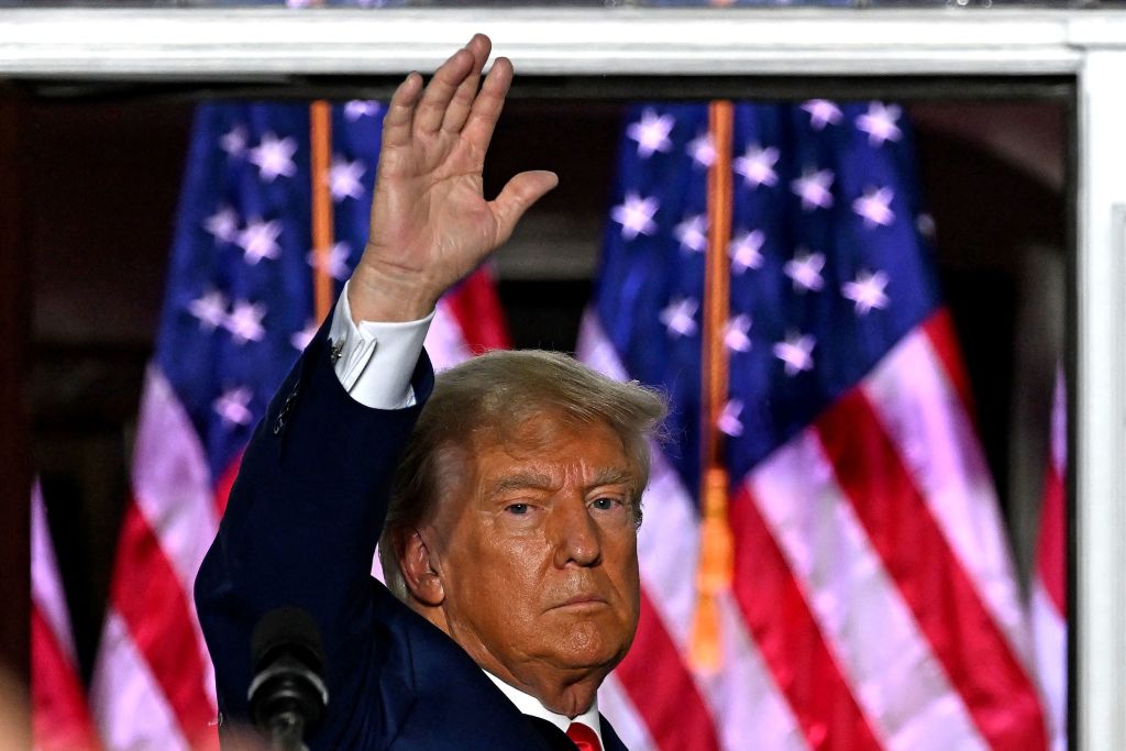 Former President Donald Trump waves after delivering remarks at Trump National Golf Club Bedminster in Bedminster, New Jersey, on June 13, 2023. Trump appeared in court in Miami for an arraignment regarding 37 federal charges, including violations of the Espionage Act, making false statements, and conspiracy regarding his mishandling of classified material after leaving office. (Photo by Ed Jones/AFP/Getty Images)