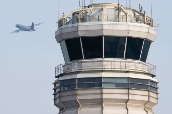 An American Airlines Airbus A319 airplane takes off past the air traffic control tower at Ronald Reagan Washington National Airport in Arlington, Virginia, January 11, 2023. (Photo by Saul Loeb/AFP/ Getty Images)