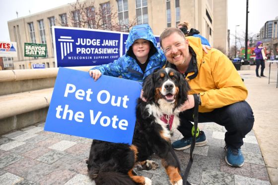 Chair of Wisconsin Democratic Party Ben Wikler and his dog Pumpkin greet attendees during Wisconsin Democrats Pet Out the Vote Event in Madison, Wisconsin. (Photo by Daniel Boczarski/Getty Images)