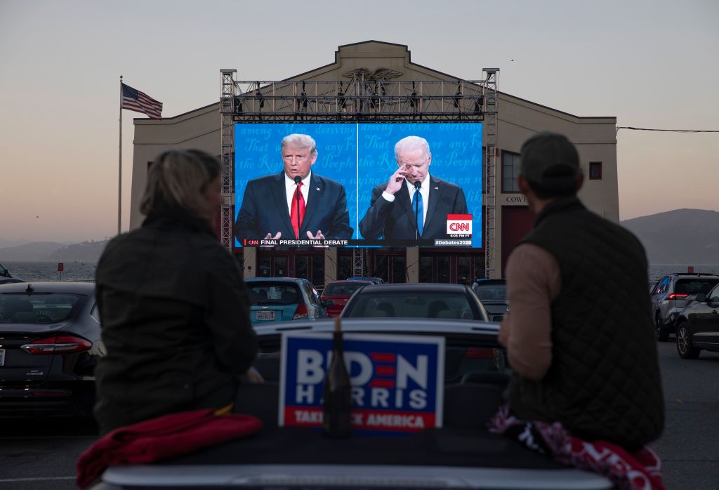 People watch the final U.S. presidential debate for the 2020 election. (Photo by Liu Guanguan/China News Service via Getty Images)