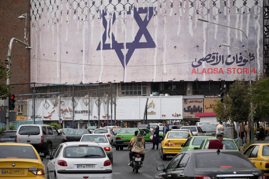 A giant anti-Israel billboard designed and implemented by the Islamic Revolutionary Guard Corps (IRGC), symbolizing Iran's support for the Palestinian Al-Aqsa storm missile attack on Israel, is hanged on a state building in downtown Tehran, October 12, 2023. (Photo by Morteza Nikoubazl/NurPhoto via Getty Images)
