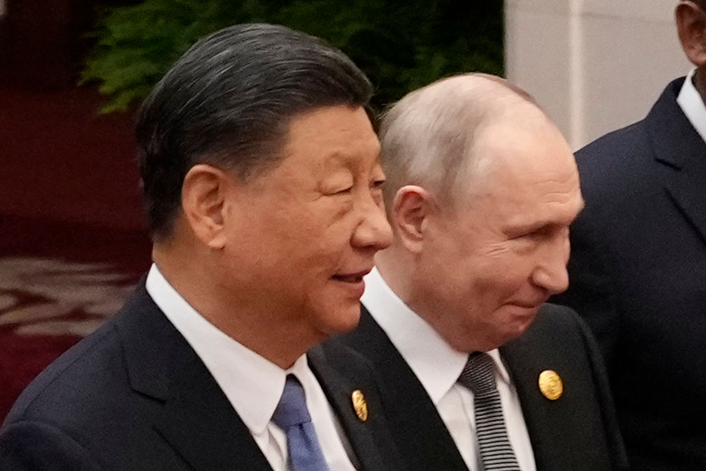 Chinese President Xi Jinping and Russian President Vladimir Putin prepare for a group photo with other leaders at the Third Belt and Road Forum on October 18, 2023 in Beijing, China. (Photo by Suo Takekuma-Pool/Getty Images)