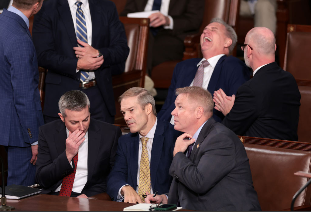 U.S. Rep. Jim Jordan talks to a staff member and Rep. Warren Davidson while former Speaker of the House Kevin McCarthy laughs, as the House of Representatives prepares to vote on a new Speaker of the House at the U.S. Capitol Building on October 17, 2023 in Washington, DC. (Photo by Win McNamee/Getty Images)