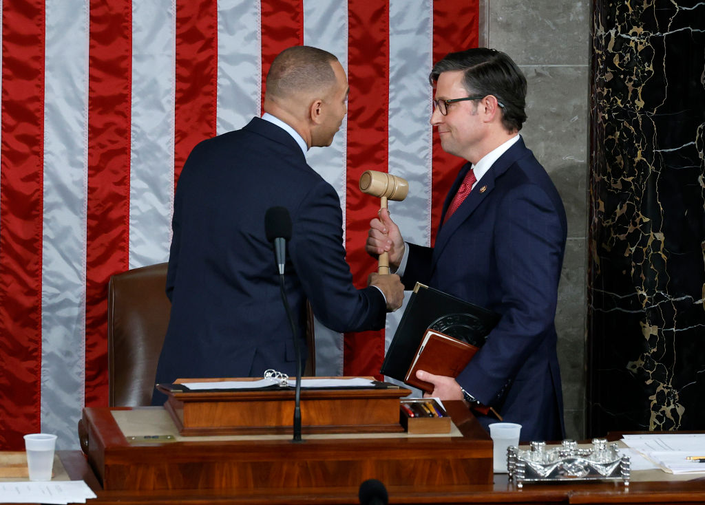 U.S. House Minority Leader Hakeem Jeffries hands the gavel to newly elected Speaker of the House Mike Johnson after the House of Representatives held an election in the U.S. Capitol on October 25, 2023 in Washington, D.C. (Photo by Chip Somodevilla/Getty Images)