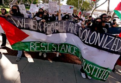 Cal State Long Beach students hold a campus rally in support of Palestinians caught up in the conflict that continued to rage unabated between Arabs and Jews in the Middle East
