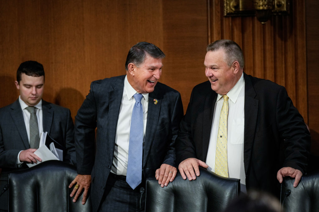 Sen. Joe Manchin talks with Sen. Jon Tester as they arrive for a Senate Appropriations Committee hearing on October 31, 2023, in Washington, D.C. (Photo by Drew Angerer/Getty Images)