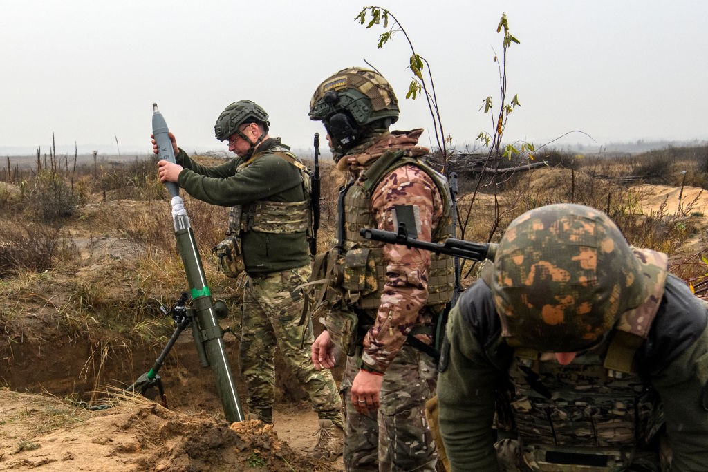 Artillerymen Mortar gunners of the First Presidential National Guard Brigade of Ukraine BUREVIY (Storm) during a practical exercise at a training ground in northern Ukraine on November 8, 2023. (Photo by Maxym Marusenko/NurPhoto via Getty Images)