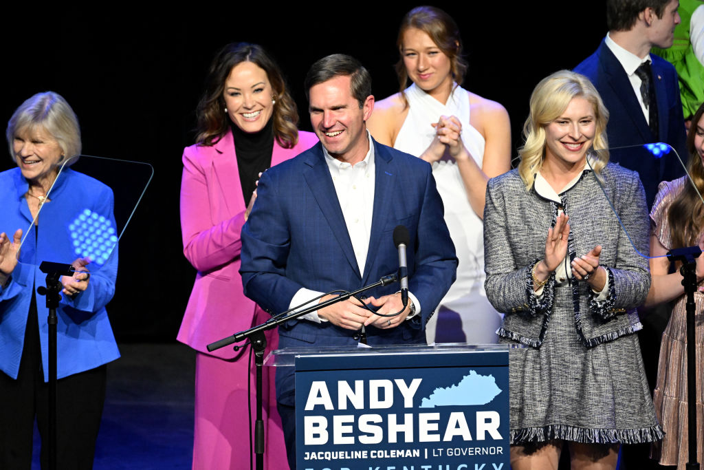 Kentucky's incumbent Democratic Gov. Andy Beshear is joined by his wife, Britainy Beshear, Kentucky Lt. Governor Jacqueline Coleman, and his family as he delivers his victory speech to a crowd at an election night event at Old Forrester's Paristown Hall on November 7, 2023 in Louisville, Kentucky. (Photo by Stephen Cohen/Getty Images)