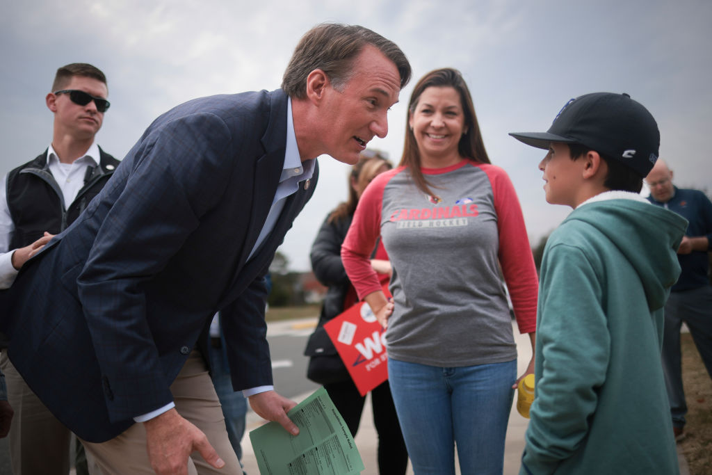 Virginia Gov. Glenn Youngkin greets voters and their children while campaigning at Piney Branch Elementary School November 7, 2023, in Bristow, Virginia.  (Photo by Win McNamee/Getty Images)