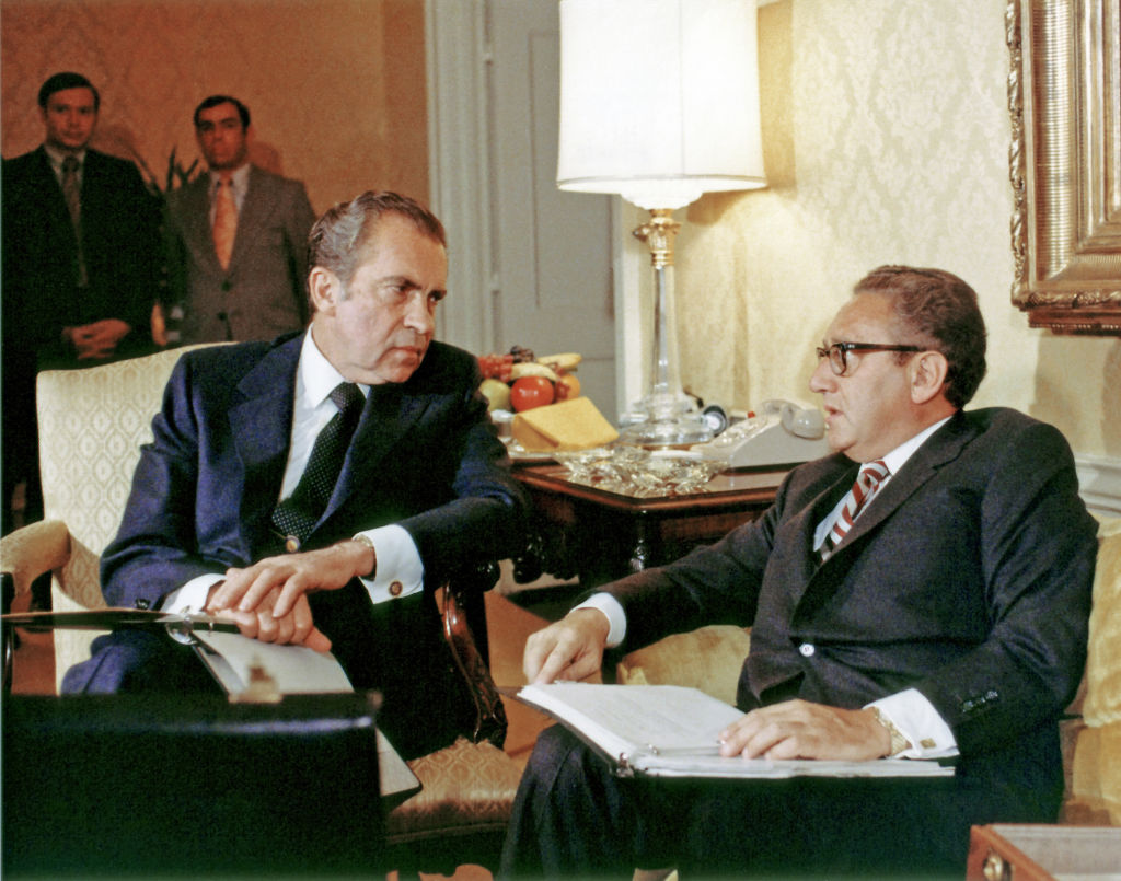 Then-U.S. President Richard Nixon and National Security Adviser Henry Kissinger talk together in Washington, D.C., on November 25, 1972. (Photo by White House via CNP/Getty Images)