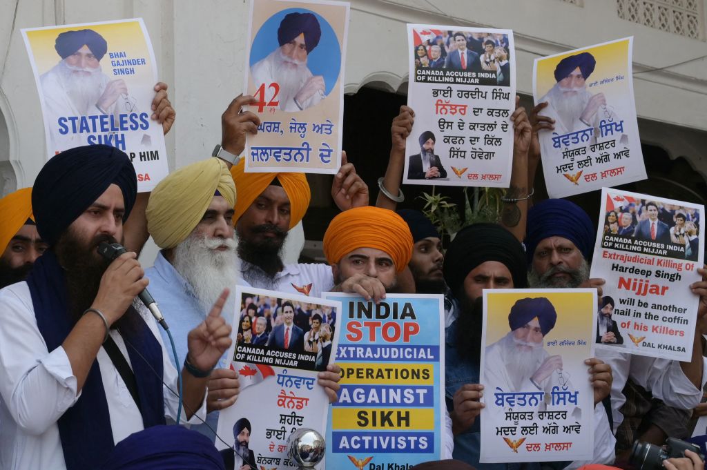 Activists of the Dal Khalsa Sikh organisation, a pro-Khalistan group, stage a demonstration demanding justice for Sikh separatist Hardeep Singh Nijjar, who was killed in June 2023 near Vancouver, after offering prayers at the at Akal Takht Sahib in the Golden Temple in Amritsar on September 29, 2023. (Photo by NARINDER NANU/AFP via Getty Images)