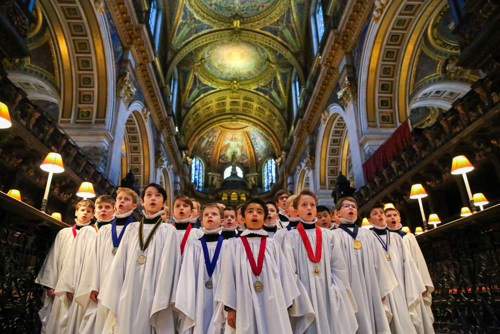 Choristers are seen rehearsing Christmas favourites at St