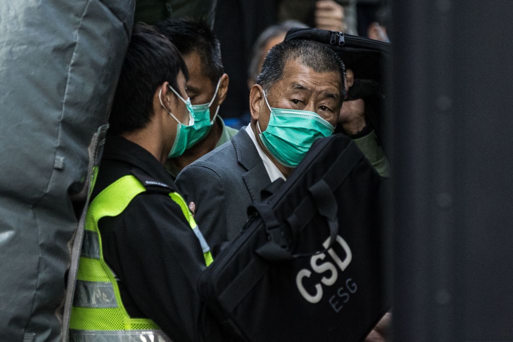 Media tycoon Jimmy Lai is escorted into a Hong Kong Correctional Services van outside the Court of Final Appeal in Hong Kong on February 1, 2021, after being ordered to remain in jail while judges consider his fresh bail application. (Photo by STR / AFP) (Photo by STR/AFP via Getty Images)
