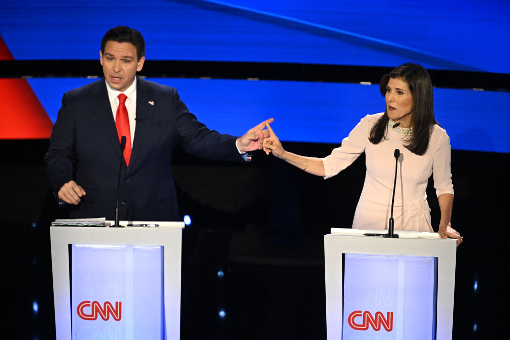 Florida Gov. Ron DeSantis and former U.S. Ambassador to the U.N. Nikki Haley speak during the fifth Republican presidential primary debate at Drake University in Des Moines, Iowa, on January 10, 2024. (Photo by Jim WATSON / AFP) (Photo by JIM WATSON/AFP via Getty Images)