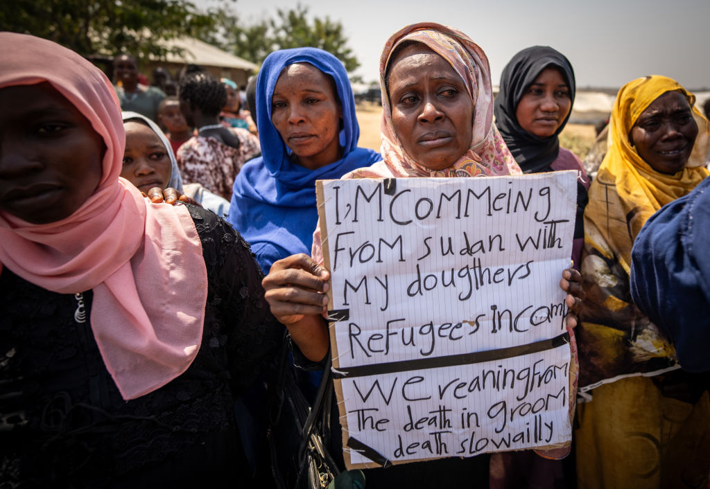 Refugees walk through the Gorom Refugee Settlement during a visit by German Foreign Minister Annalena Baerbock on January 26, 2024. (Photo by Michael Kappeler/picture alliance via Getty Images)