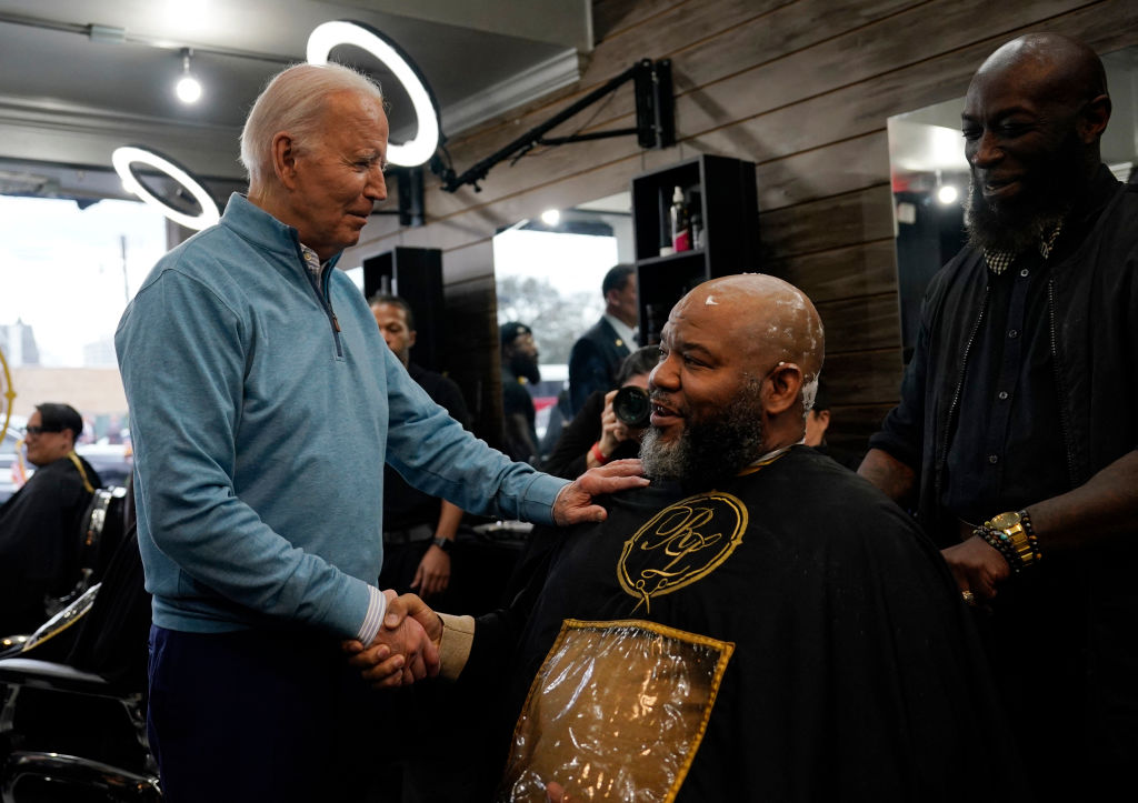 President Joe Biden greets staff and patrons at Regal Lounge, a men's barbershop and spa, in Columbia, South Carolina, on January 27, 2024. (Photo by KENT NISHIMURA/AFP via Getty Images)