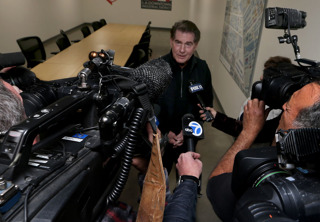 News cameras focus on Dodgers legend Steve Garvey during a visit to the Downtown Center Business Improvement District offices in Los Angeles on Thursday afternoon, Jan. 11, 2024. Garvey is campaigning to represent California in the U.S. Senate, an office that formerly was held by the late Sen. Dianne Feinstein. (Los Angeles Times via Getty Images)