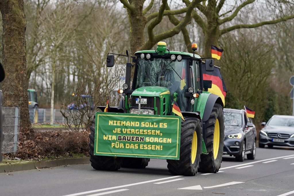Farmers gather on February 17, 2024, to stage a protest against the coalition government's agricultural policies as they convoy with tractors and other agricultural vehicles in Dusseldorf, Germany. (Photo by Kadir Ilboga/Anadolu via Getty Images)