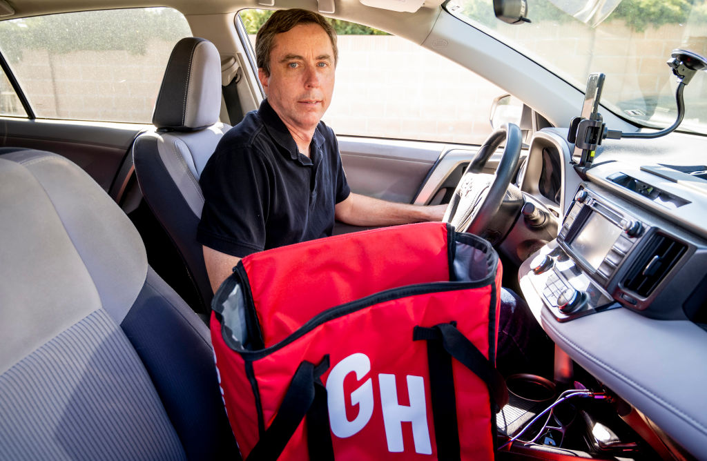 Lawrence Thomas—a delivery driver for Uber Eats, DoorDash and Grubhub—pictured in his car at his home in Orange County, California, on Wednesday, March 9, 2022. (Photo by Leonard Ortiz/MediaNews Group/Orange County Register via Getty Images)