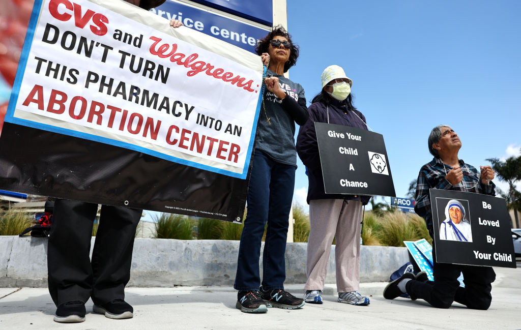 Demonstrators protest against abortion pill sales outside a CVS Pharmacy in Torrance, California, on March 26, 2024, the same day the justices of the U.S. Supreme Court hear oral arguments in U.S. Food and Drug Administration v. Alliance for Hippocratic Medicine.(Photo by Mario Tama/Getty Images)