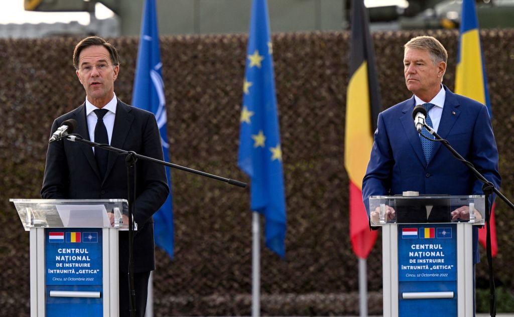 Dutch Prime Minister Mark Rutte (left) and Romanian President Klaus Iohannis address members of the Romanian, French, Belgian and Dutch militaries on October 12, 2022. (Photo by DANIEL MIHAILESCU/AFP via Getty Images)