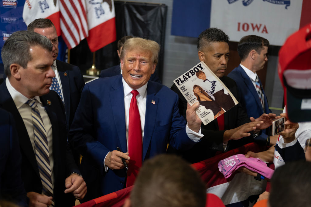 Former President Donald Trump signs items for a crowd of supporters at the Fort Dodge Senior High School on November 18, 2023, in Fort Dodge, Iowa. (Photo by Jim Vondruska/Getty Images)