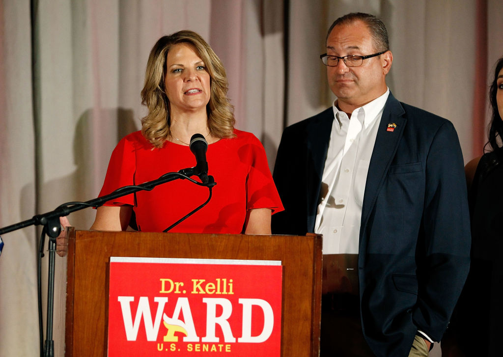 Kelli Ward, then a Republican candidate for the U.S. Senate, gives a concession speech with her husband Michael Ward in Scottsdale, Arizona, on August 28, 2018. (Photo by Ralph Freso/Getty Images)