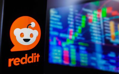 In this photo illustration, the Reddit logo is displayed on