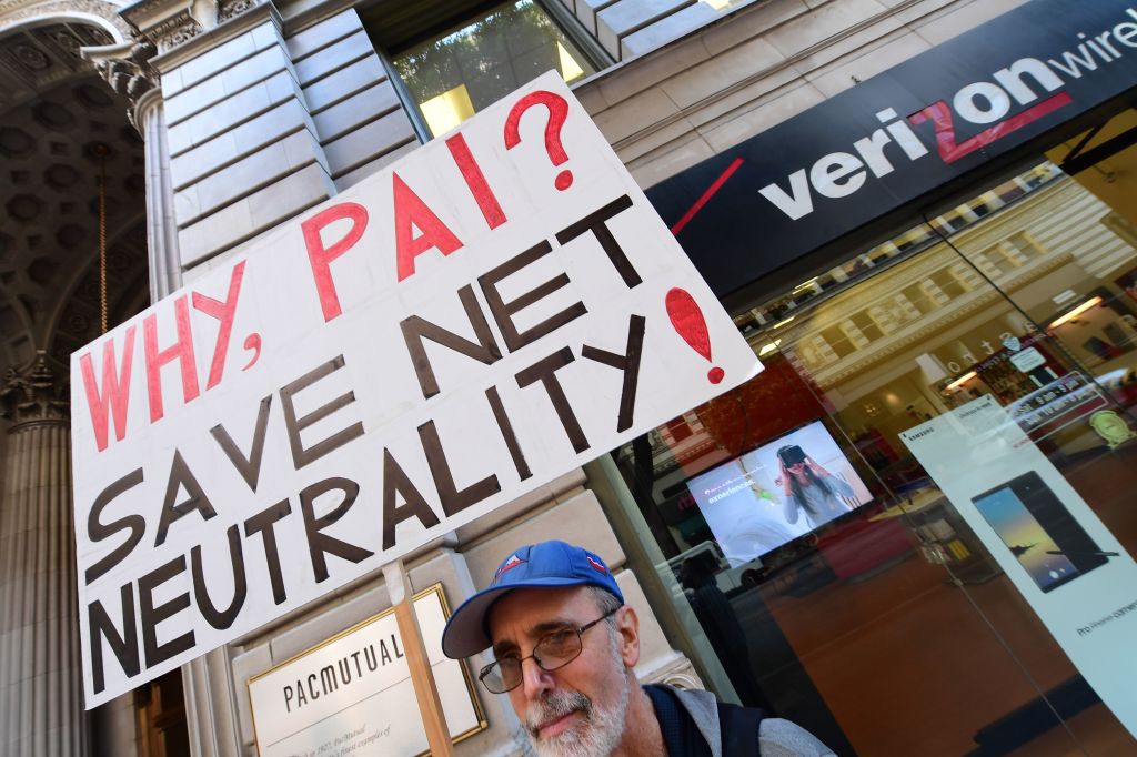 A small group of protesters supporting net neutrality protest against a plan by FCC head Ajit Pai, during a protest outside a Verizon store on December 7, 2017, in Los Angeles.  (ROBYN BECK/AFP via Getty Images)