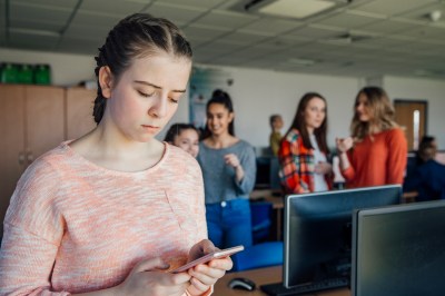 Teenage Girl Being Bullied By Text Message