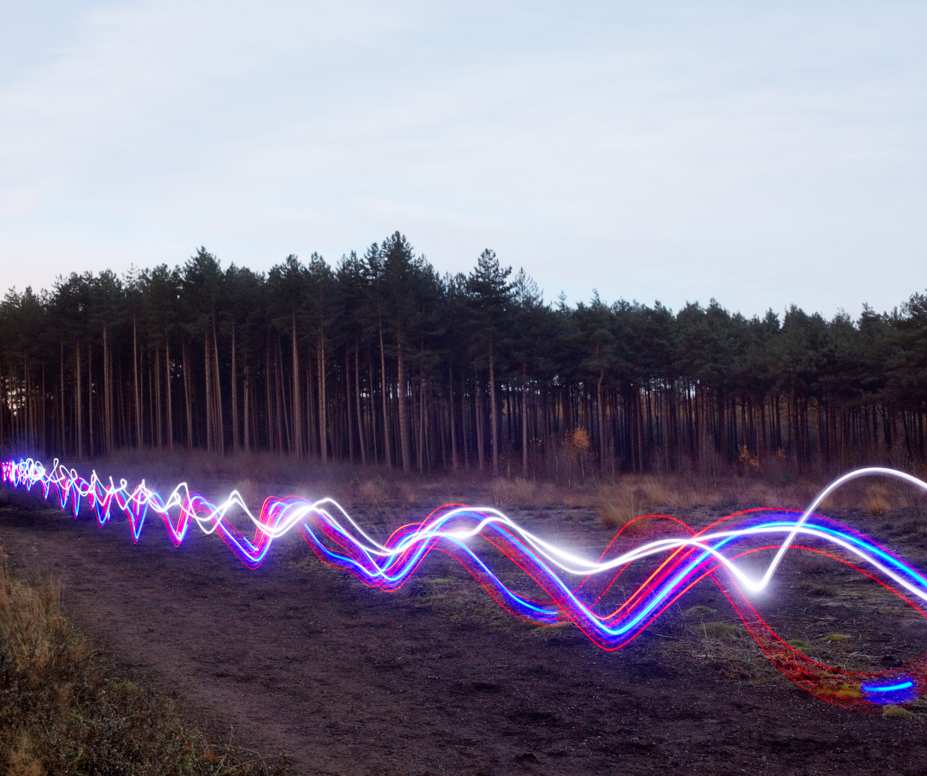 Red, blue and white light trails on heath.