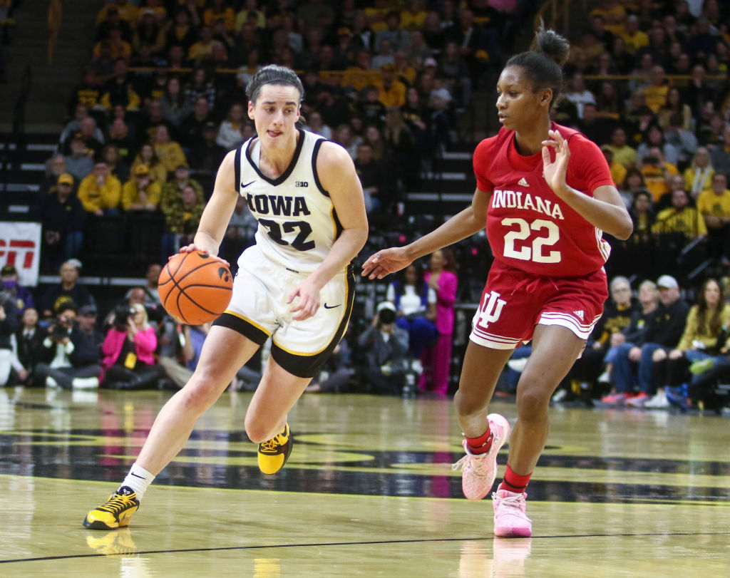 Caitlin Clark of the Iowa Hawkeyes drives down the court during the first half against guard Chloe Moore-McNeil of the Indiana Hoosiers at Carver-Hawkeye Arena in Iowa City on February 26, 2023. (Photo by Matthew Holst/Getty Images)