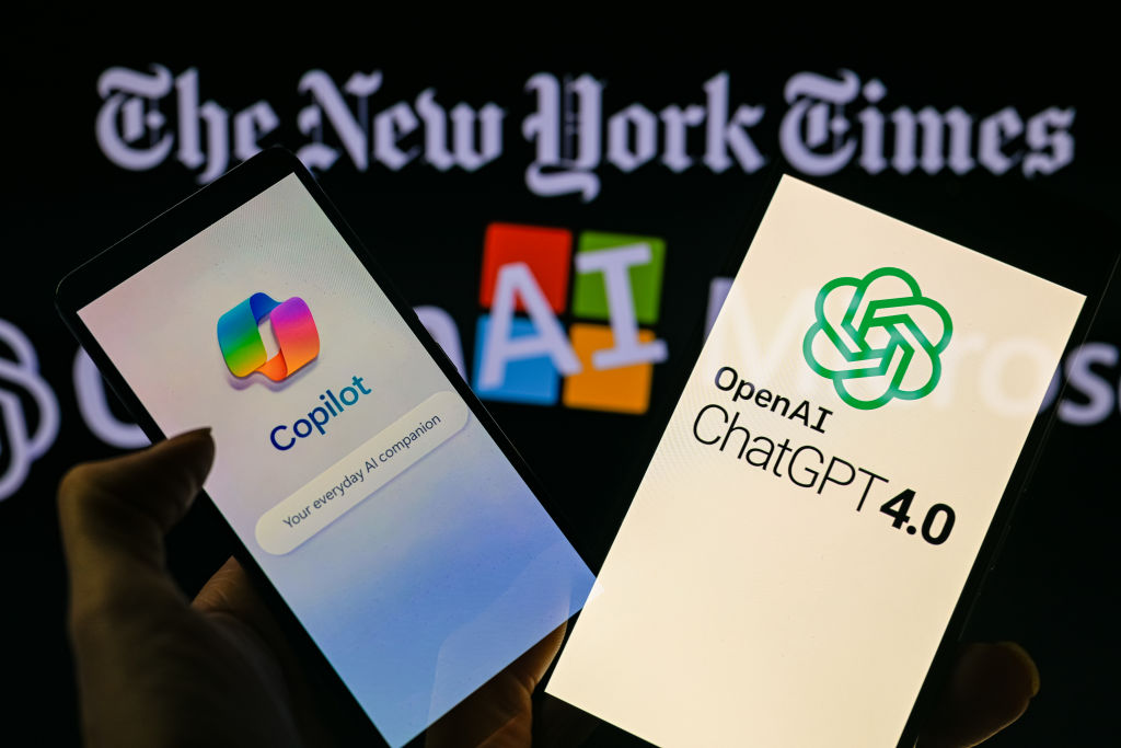 Smartphones display OpenAI ChatGPT and Microsoft Copilot with The New York Times in the background in this photo illustration taken in Brussels, Belgium, on December 28, 2023. (Photo Illustration by Jonathan Raa/NurPhoto via Getty Images)