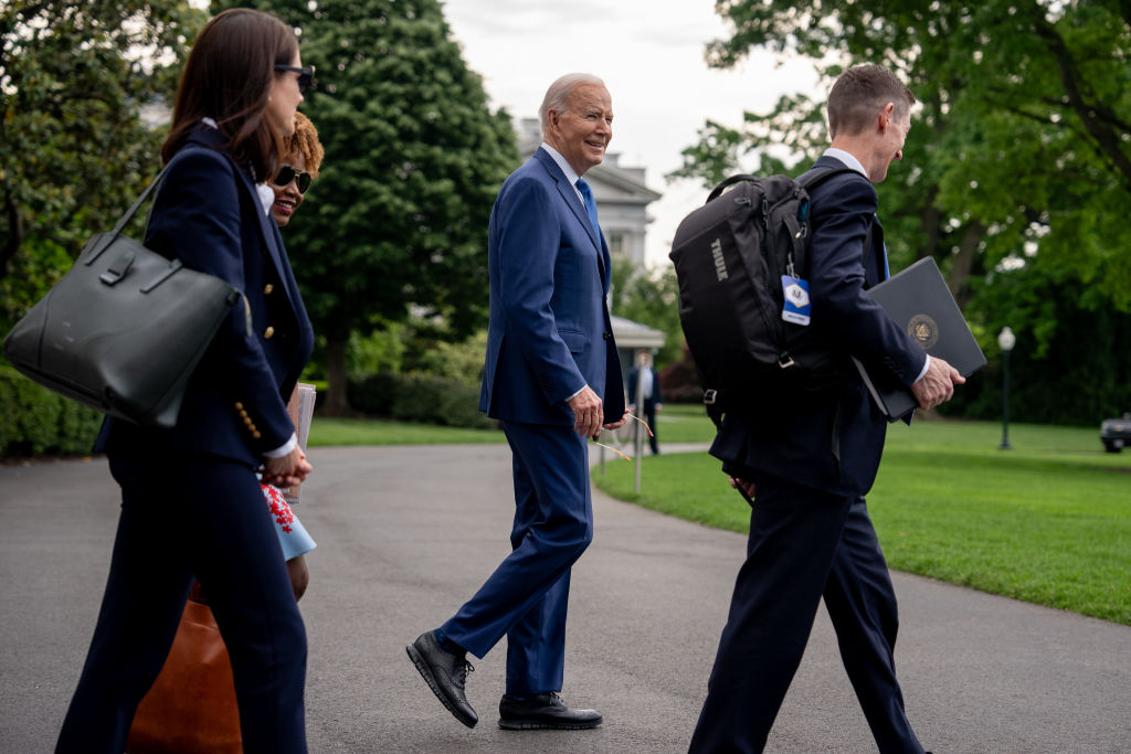 President Joe Biden, accompanied by Deputy Chief of Staff Bruce Reed and other aides, walks to Marine One on the South Lawn of the White House as he departs for a campaign trip to Wisconsin and Illinois on May 8, 2024. (Photo by Andrew Harnik/Getty Images)