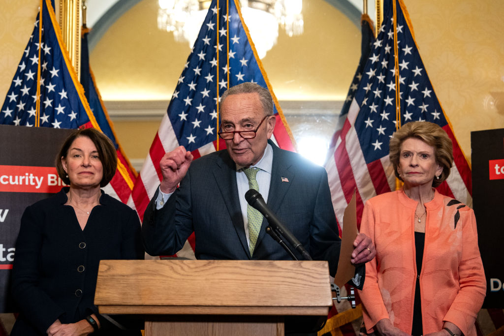 Senate Majority Leader Chuck Schumer, flanked by Sens. Amy Klobuchar and Debbie Stabenow, speaks during a news conference on Capitol Hill on May 22, 2024.(Photo by Kent Nishimura/Getty Images)