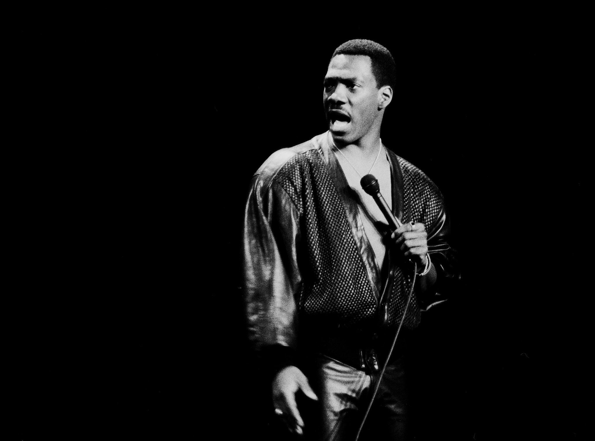 Comedian Eddie Murphy performs onstage at Madison Square Garden in New York City on October 13, 1987. (Photo by Gary Gershoff/Getty Images)