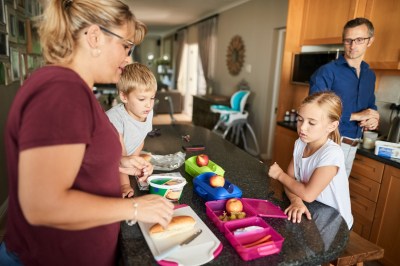 Mother preparing school lunch boxes