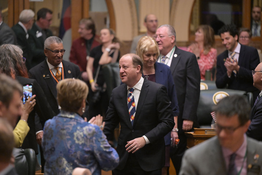 Colorado Gov. Jared Polis visits with state House and Senate members before the 2024 state of the state address at the State Capitol in Denver on January 11, 2024. (Photo by Hyoung Chang/The Denver Post)