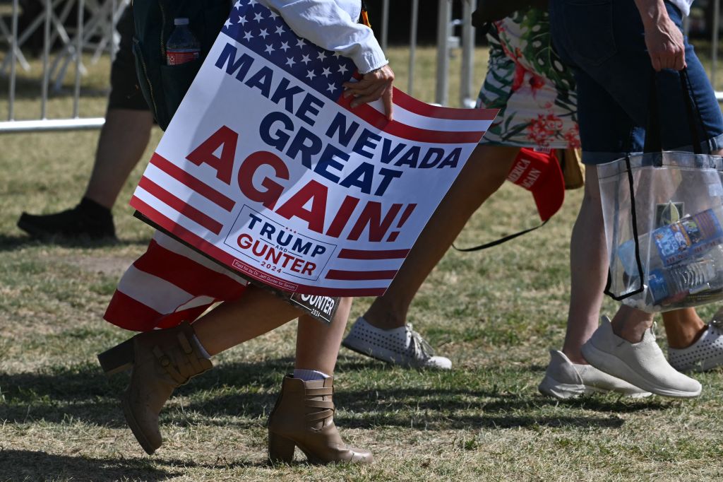 Supporters of former President and Republican presidential candidate Donald Trump arrive before the start of a campaign rally at Sunset Park in Las Vegas, Nevada, on June 9, 2024. (Photo by JIM WATSON/AFP via Getty Images)