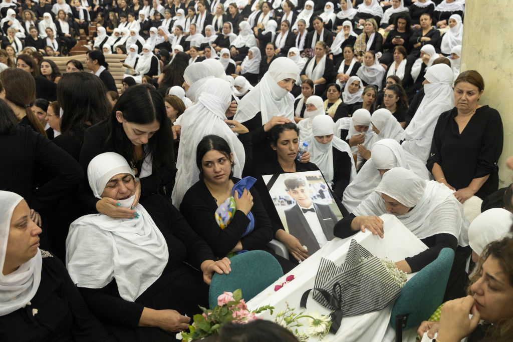 Mourners attend a funeral in Majdal Shams on July 28, 2024, for 10 of the victims of a rocket attack by Hezbollah. (Photo by Amir Levy/Getty Images)